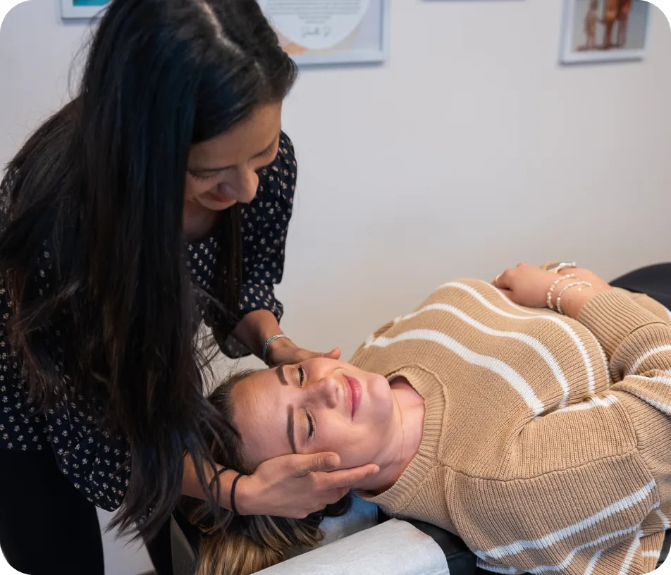 Pregnant woman receiving a gentle, specific adjustment from a Webster-Certified chiropractor